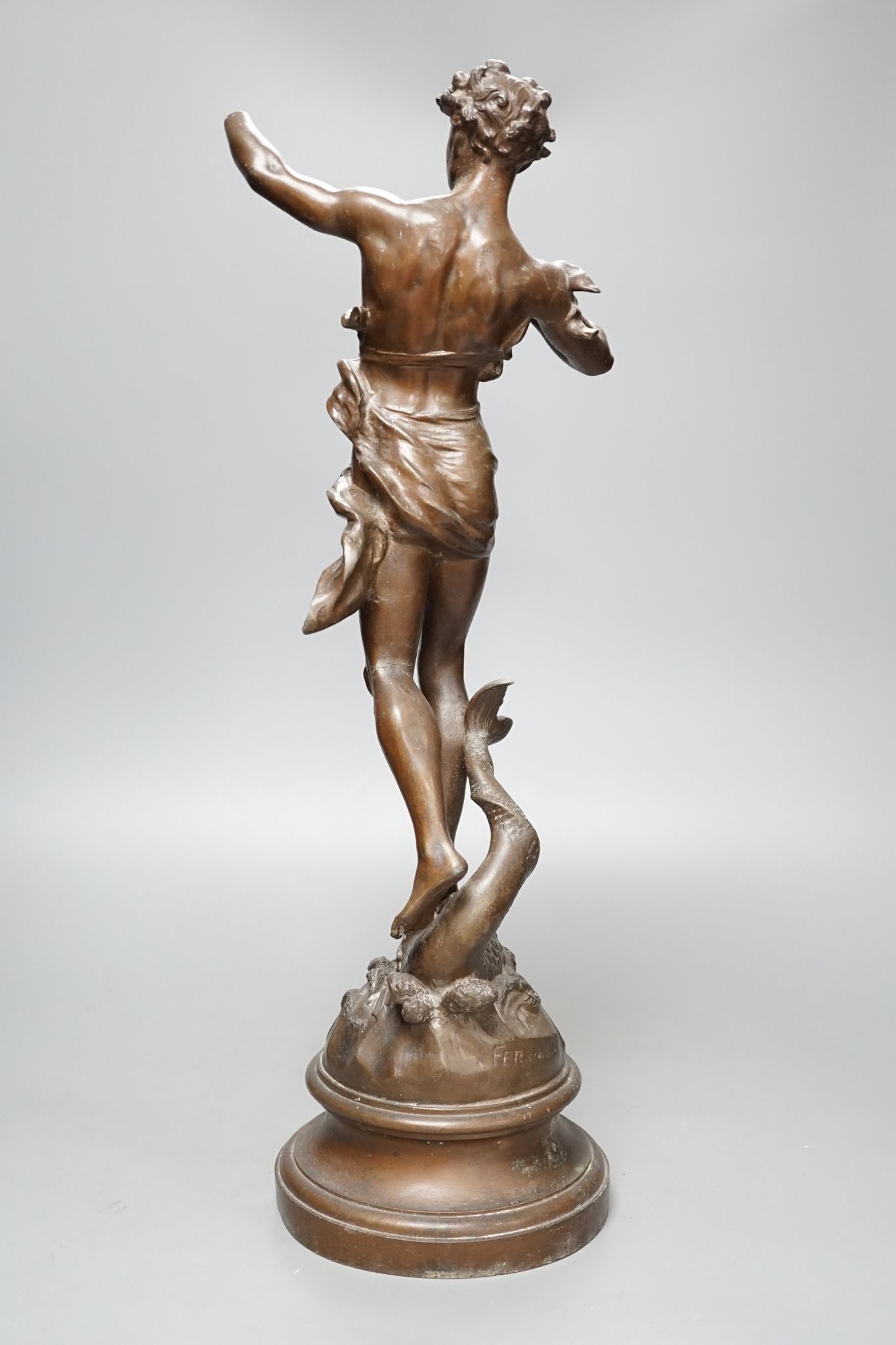 After Ferrand, a spelter figure of a gentleman upon a dolphin, plaque to base reading ‘Zephyr Marin Par Ferrand’, 50cm